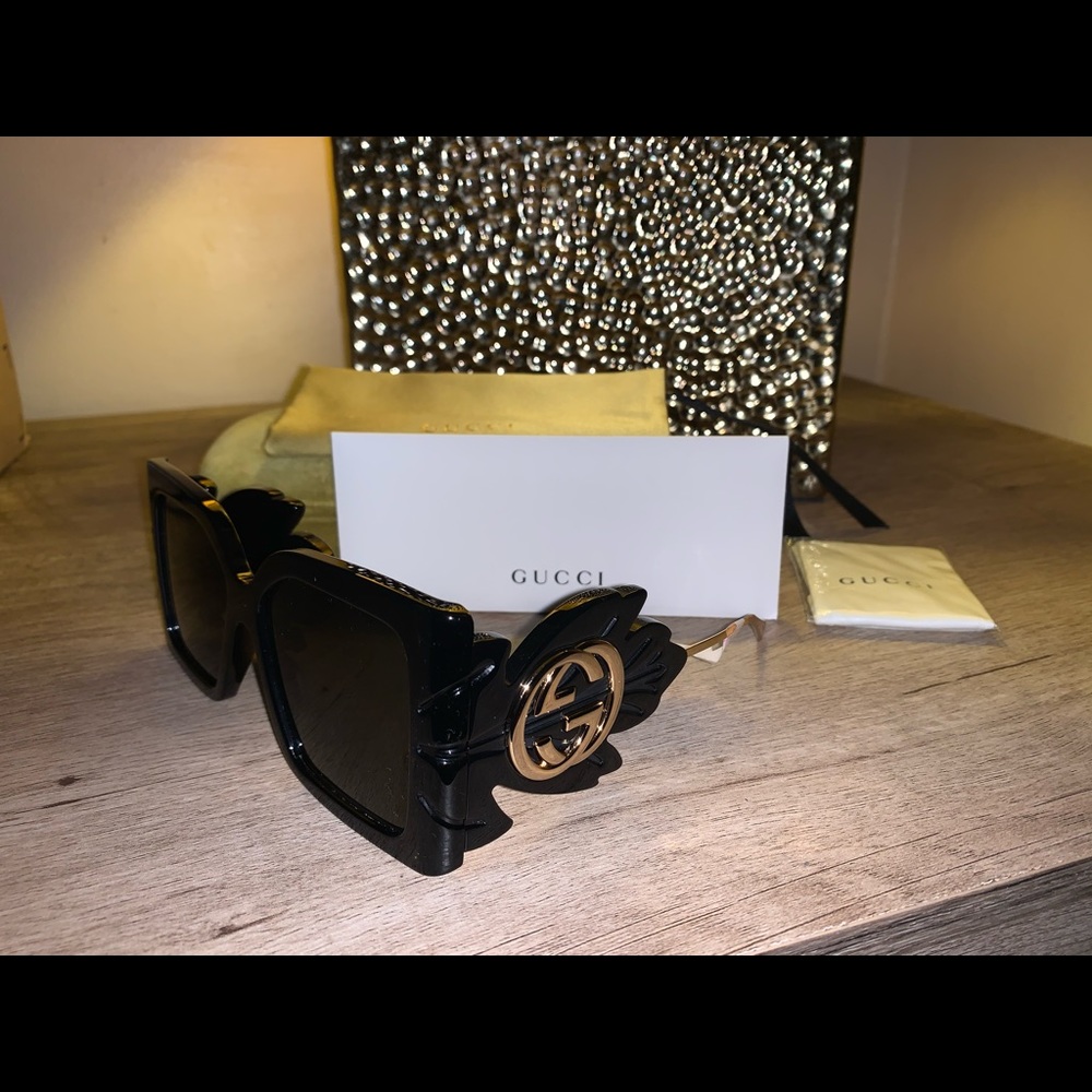 Gucci / authentic sunglasses / Black & Gold / originally $1015.00 / Black Leaf.